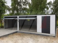 Biela plechová garáž, spád strechy dozadu 8 m × 6 m, brány grafit